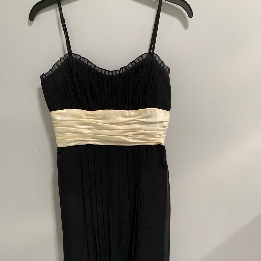 Spaghetti strap dress with satin waist.